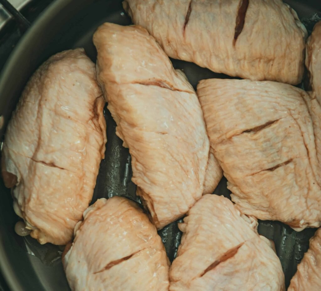  Chicken Breast on a frying pan, a high protein food for muscle growth