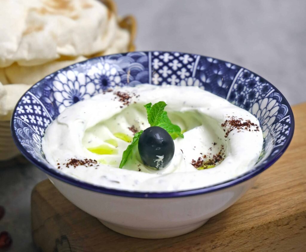Greek Yogurt with berry and mint leaves