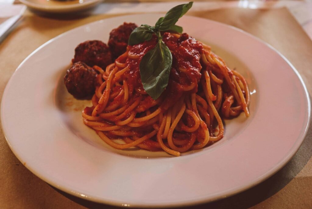 Turkey Meatballs with Zucchini Noodles and Marinara Sauce (1) Turkey Meatballs with Zucchini Noodles and Marinara Sauce on a white plate