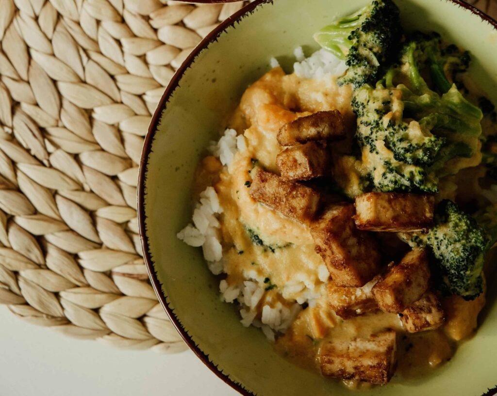 Vegan Tofu Stir-Fry with Broccoli and Brown Rice Vegan tofu stir-fry with broccoli and brown rice on a plate