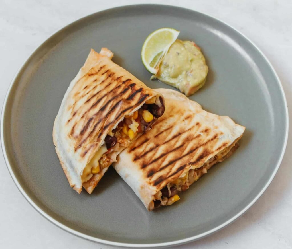 A gray plate with Turkey Quesadilla meal